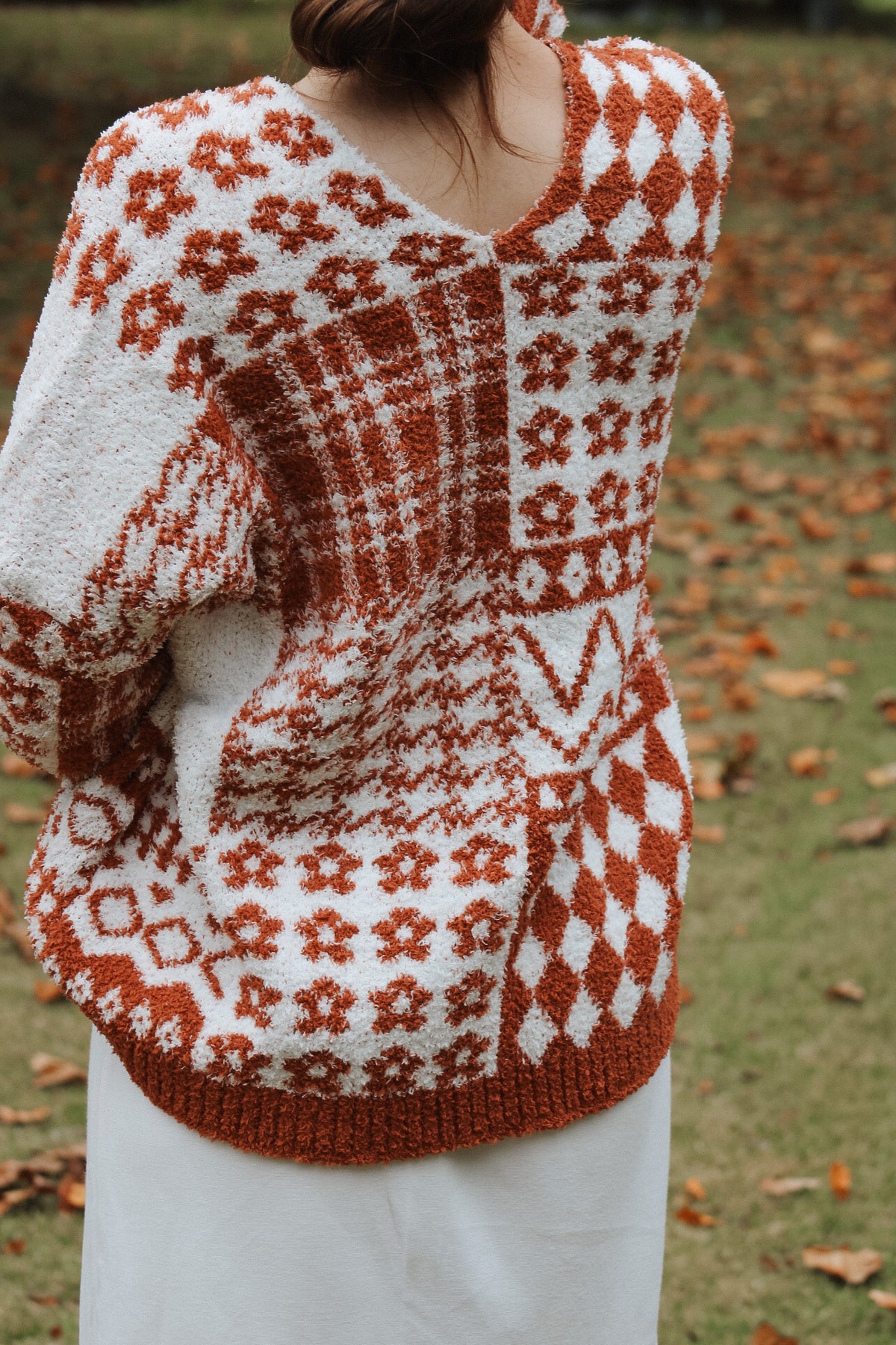 THE AUTUMN-RUST FLORAL CHECKER KNIT SWEATER